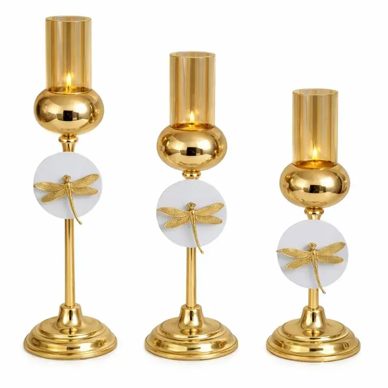 Bougeoir décoratif doré sur pied avec motif libellule et verre fumé