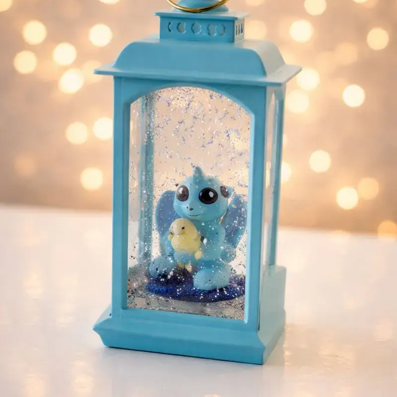 Lanterne décorative bleue avec figurine et effet paillettes